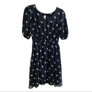 Black midi dress with white polka dots.